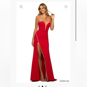 From the Sherri Hill 2023 spring collection. It’s red and is a size 2